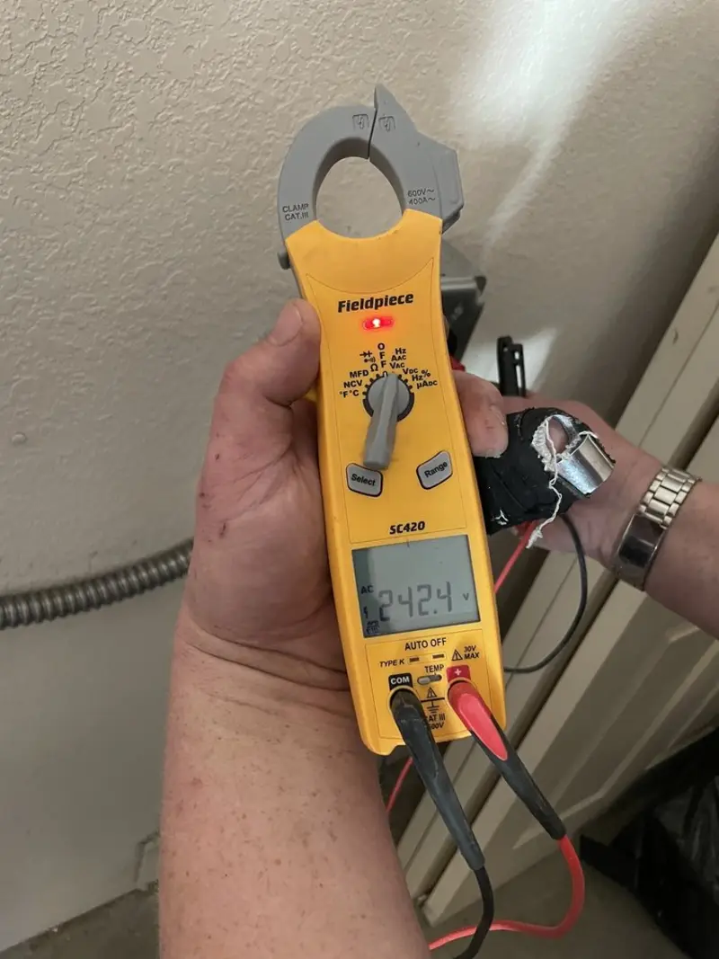 Voltage testing with clamp meter during Recessed Lighting Installation in Rib Mountain